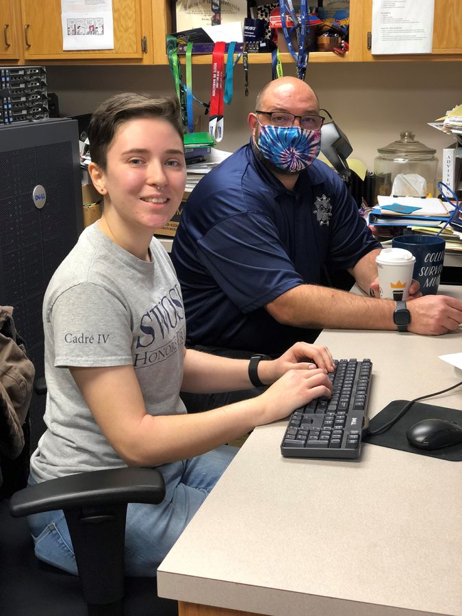 Southwestern Oklahoma State University student Arianna Martin of Broken Arrow visits with Dr. Jeremy Evert, associate professor of computer science, about her upcoming summer internship with British Petroleum.