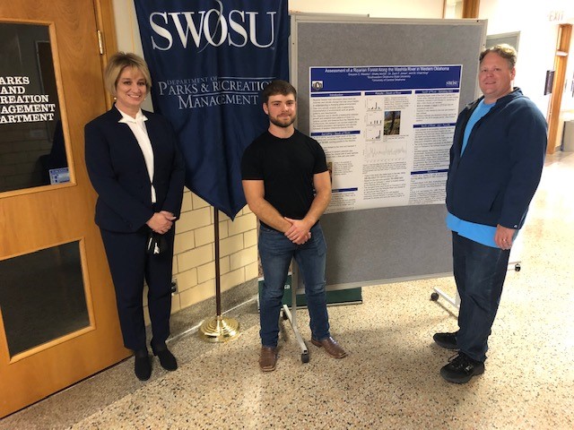 SWOSU student Greyson Weedon of Apache recently presented research on Washita Riparian forests on the Weatherford campus. With him are (left) SWOSU President Dr. Diana Lovell and (right) Dr. Zach Jones, associate professor in the Allied Health Sciences Department.