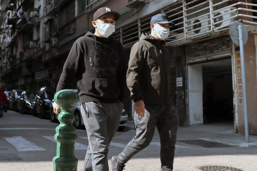 Two men in Macau with masks. So far, there have been two cases of the Coronovirus in Oklahoma.