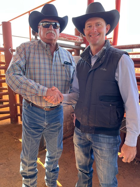 SWOSU Head Rodeo Coach Mike Visnieski (right) thanks Elk City Rodeo Committee member Larry McConnell for the committee’s generous gift to the SWOSU Rodeo Program.